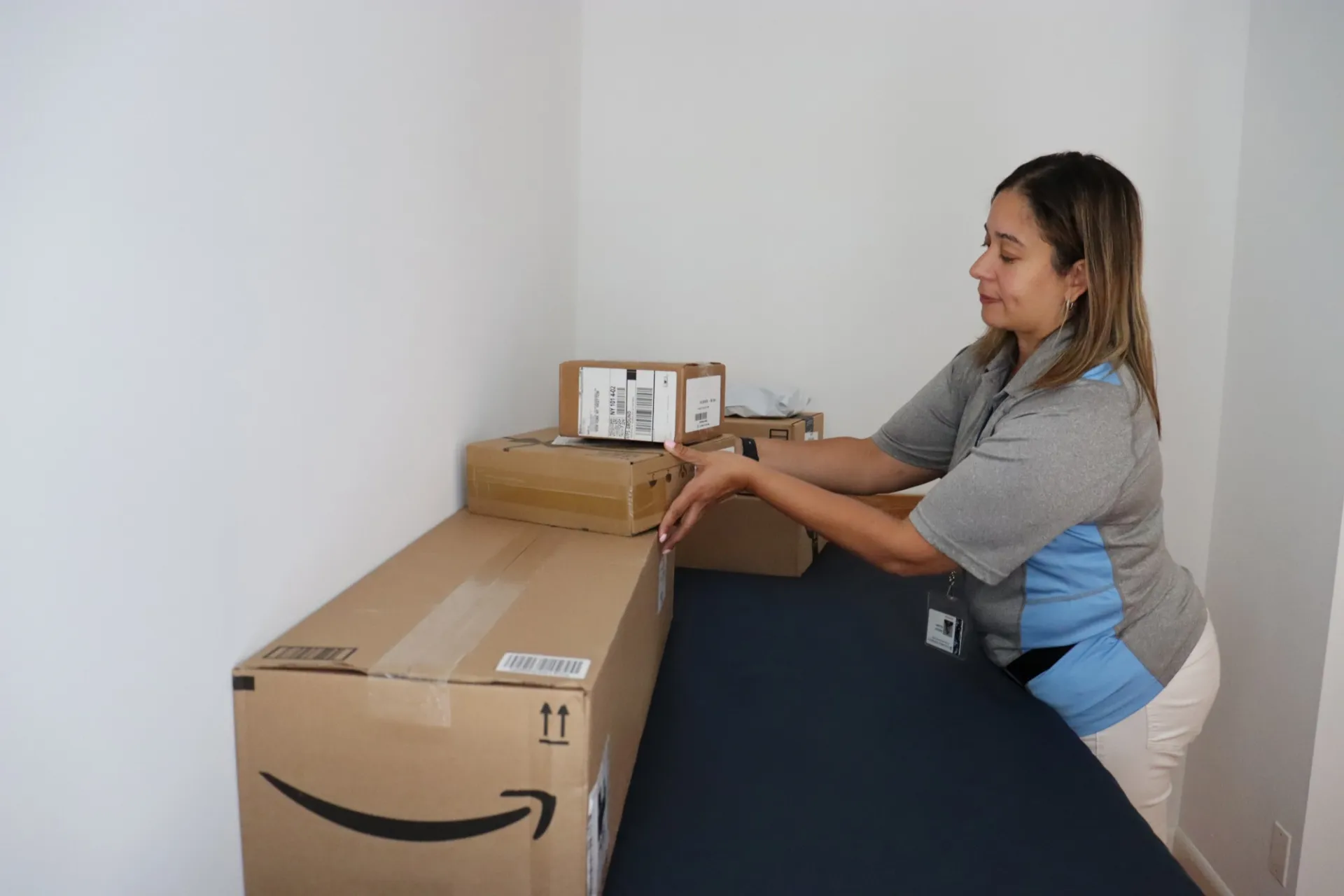 Mail team member delivering a student's packages to their room