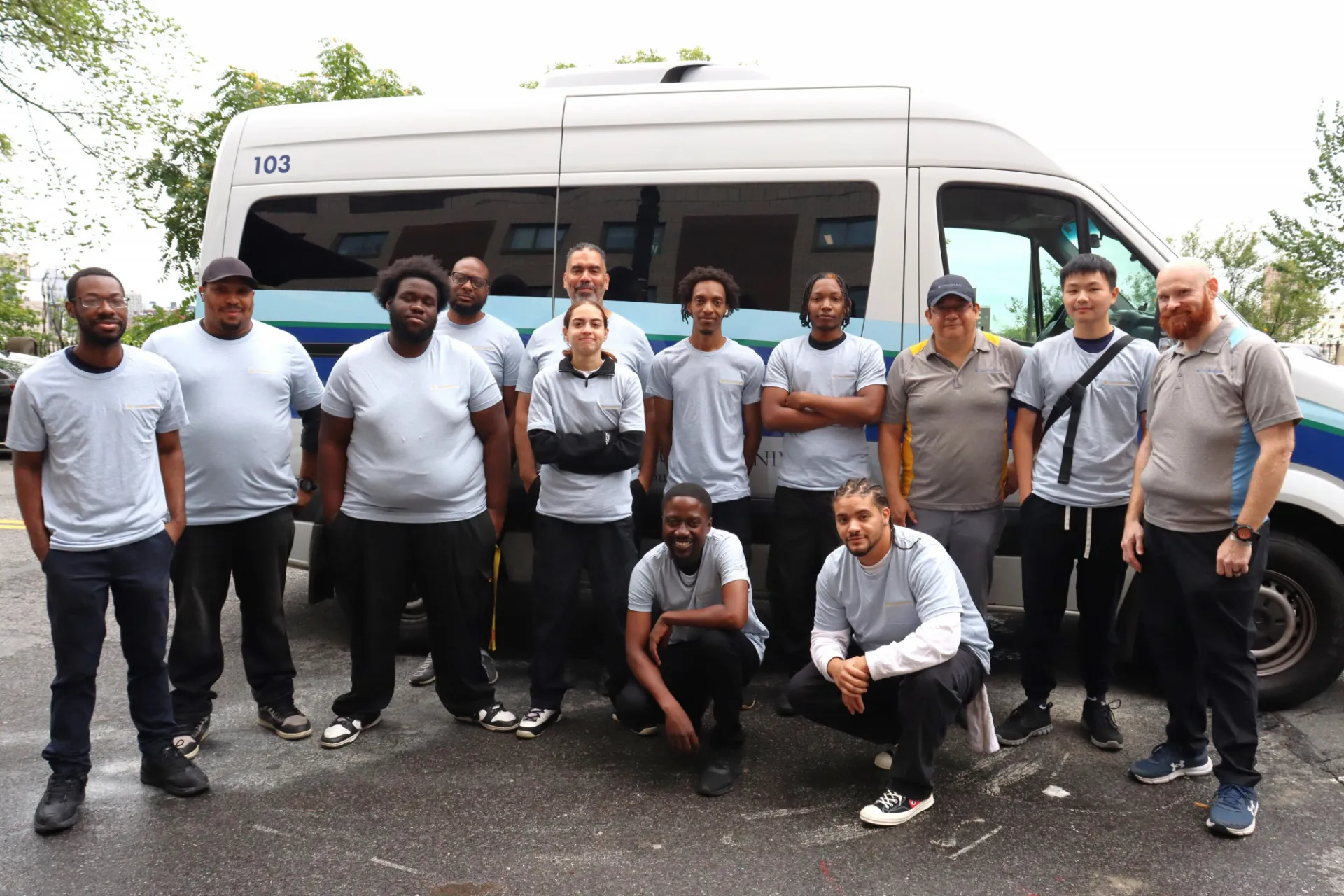 pre-delivery team posing with the mail vehicle
