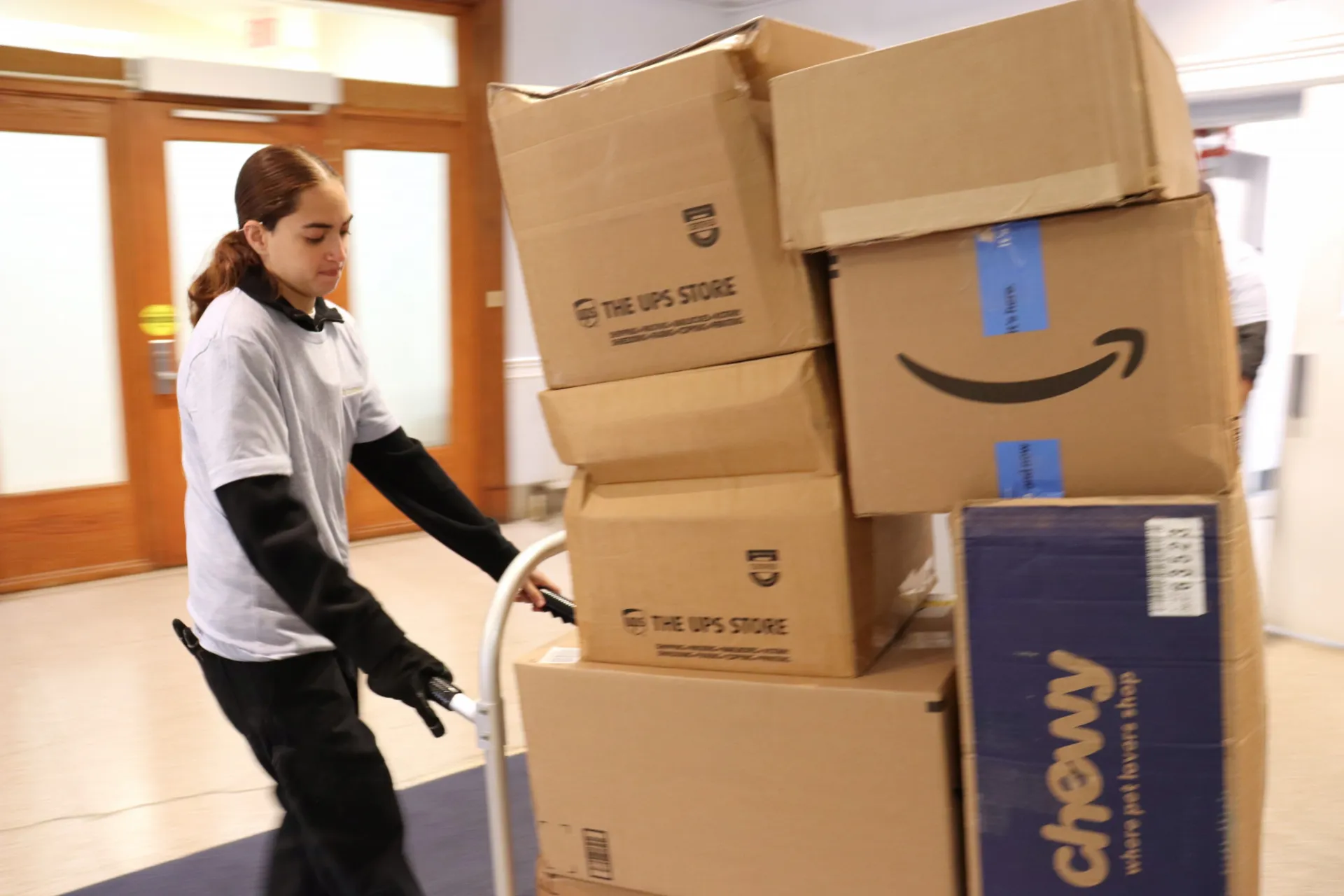Packages on hand truck leaving Wien Hall