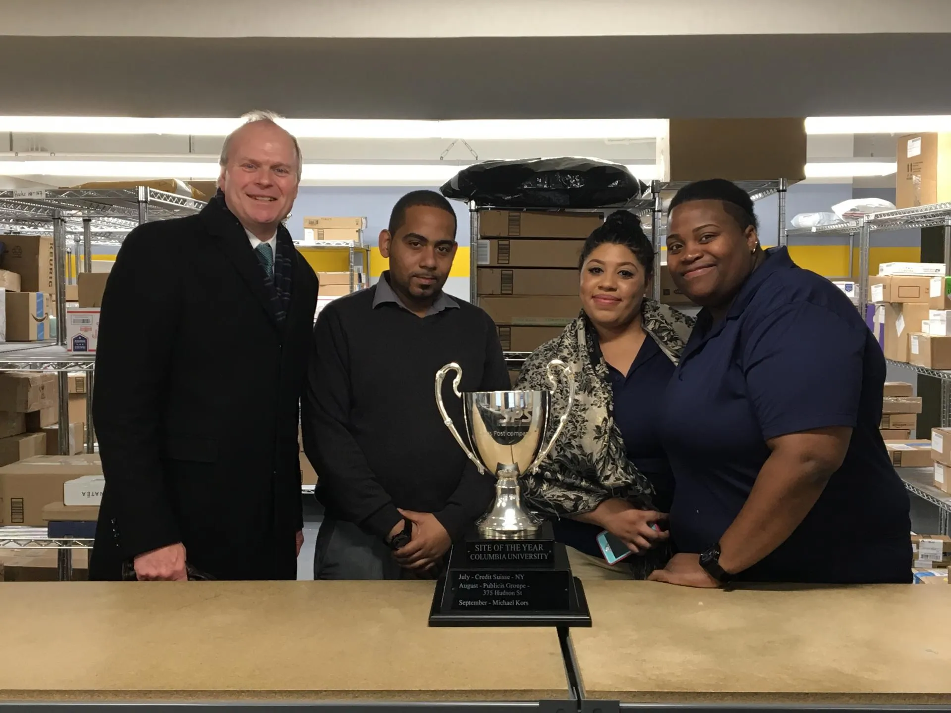 Columbia Mail team with their award